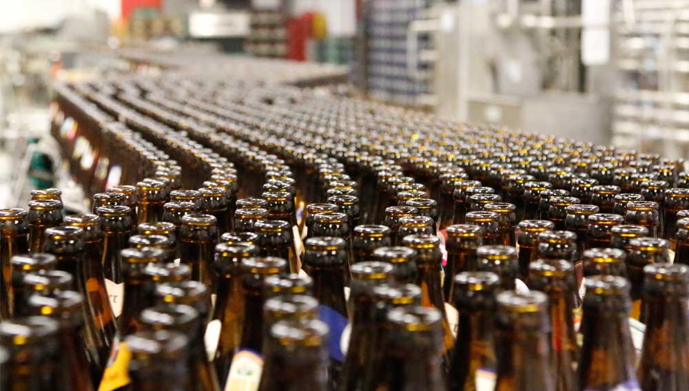 How can buffer sections in beverage bottling plants be ideally organized?