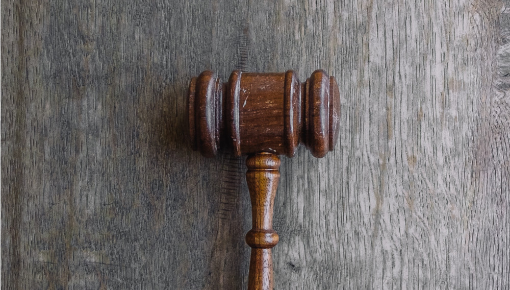 Court hammer (Photo: Wesley Tingey on Unsplash)