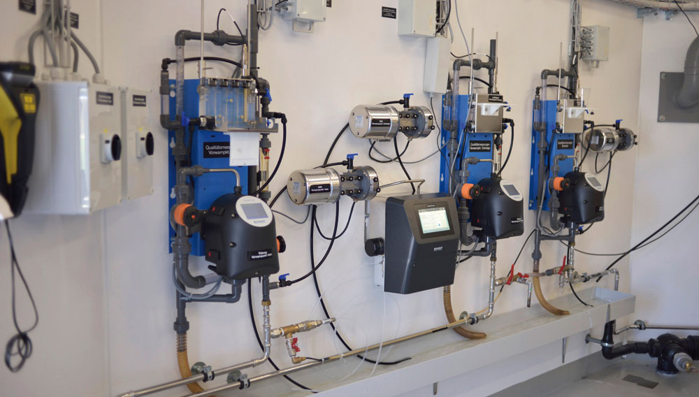 BactoSense online flow cytometer mounted on the wall along with other online analysis equipment at a Swiss water utility (Photo: Sigrist Photometer AG)